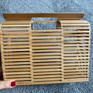 wood framed purse, perfect for a beach trip